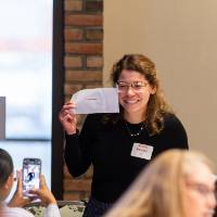 person holding up piece of paper